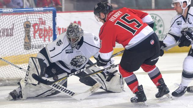 James Henry of the Adirondack Thunder tests the Manchester Monarchs goaltender