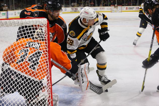 Lehigh Valley Phantoms goaltender Alex Lyon and his defense attempt to hold off the Providence Bruins
