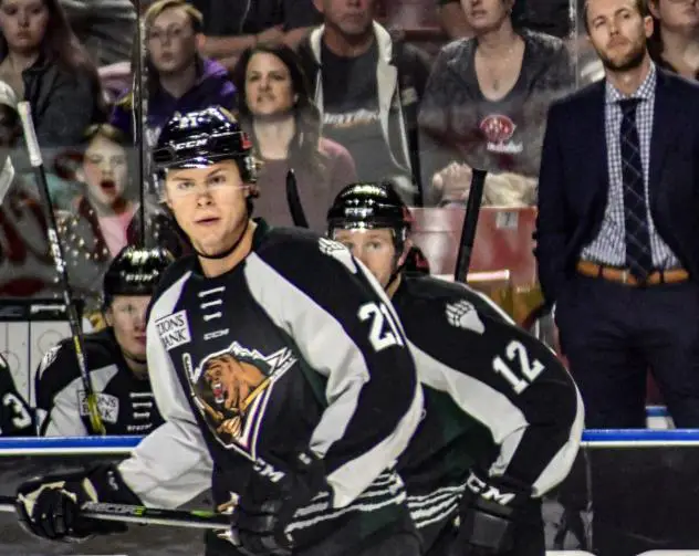Utah Grizzlies forwards Austin Carroll (21) and Cole Ully