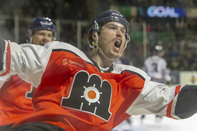 Maine Mariners celebrate a goal in their throwback uniforms