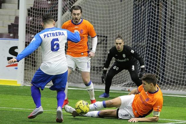 Mississauga MetroStars' Adrian Cann and Marco Rodriguez defend their goal against Utica City FC