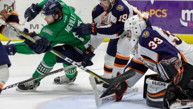 Greenville Swamp Rabbits goaltender Garrett Bartus and his defense try to stop the Florida Everblades