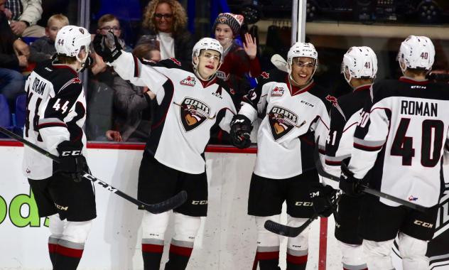 Brayden Watts and the Vancouver Giants celebrate Watts' goal