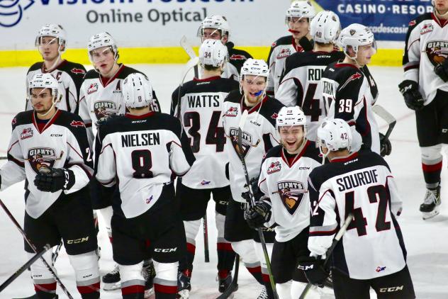 Vancouver Giants exchange congratulations after defeating the Kamloops Blazers