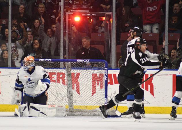 Austin Carroll of the Utah Grizzlies (21) celebrates a goal against the Wichita Thunder