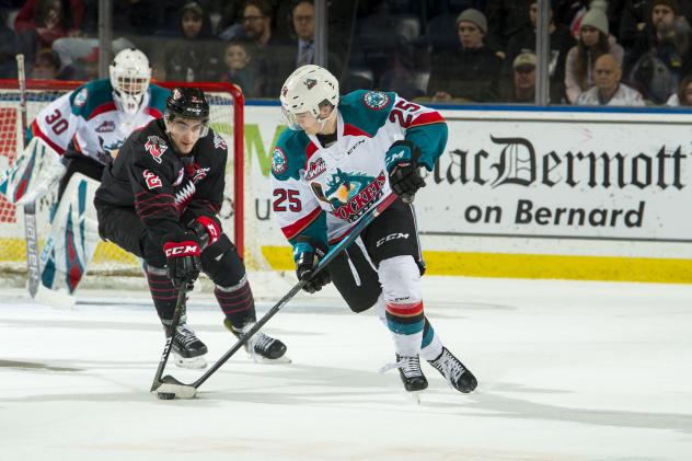 Kelowna Rockets centre Kyle Crosby handles the puck against the Prince George Cougars