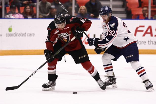 Vancouver Giants centre Justin Sourdif (left) against the Tri-City Americans