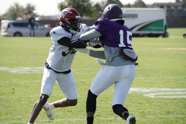 Channing Stribling of the Memphis Express (left) in a joint practice with the Atlanta Legends