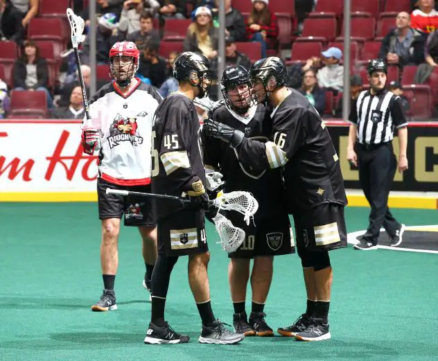 Vancouver Warriors huddle against the Calgary Roughnecks