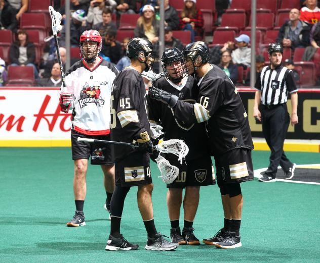 Vancouver Warriors huddle against the Calgary Roughnecks