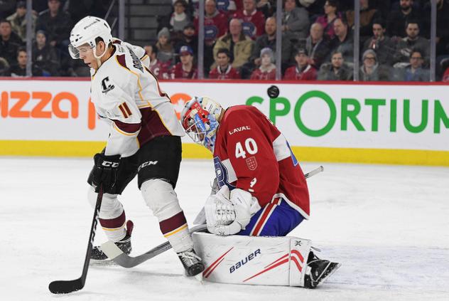 Cleveland Monsters right wing Vitaly Abramov and Laval Rocket goaltender Michael McNiven