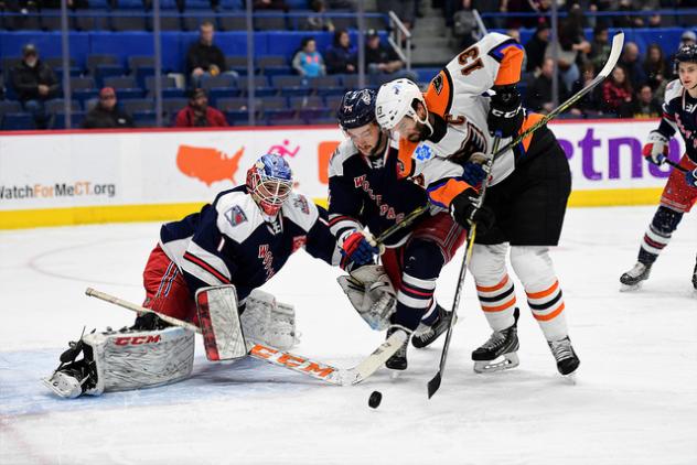 Lehigh Valley Phantoms right wing Colin McDonald battles in front of the Hartford Wolf Pack goal