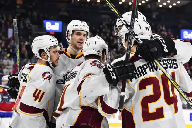 Cleveland Monsters celebrate a goal against the Laval Rocket