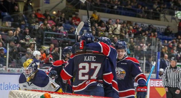 Saginaw Spirit celebrate a goal against the Erie Otters