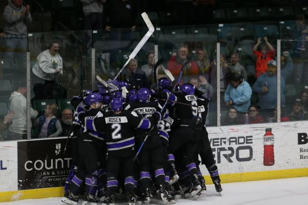 Tri-City Storm celebrate against the Muskegon Lumberjacks