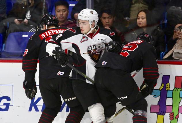 Vancouver Giants centre Tristen Nielsen sandwiched between the Moose Jaw Warriors