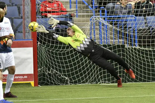 Tacoma Stars goalkeeper Mike Agruello dives for an Ontario Fury shot attempt