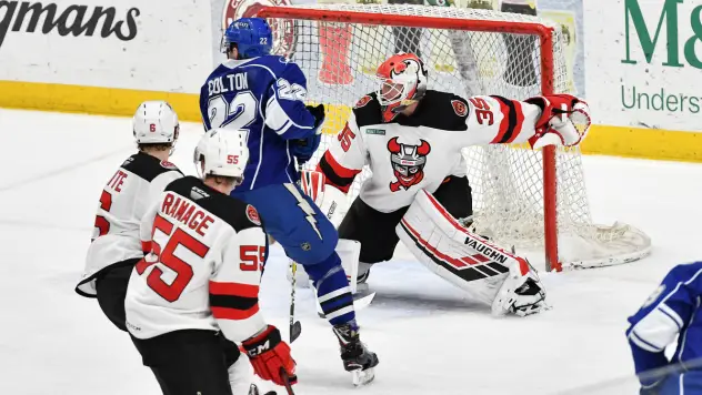 Binghamton Devils goaltender Cory Schneider turns aside the Syracuse Crunch attack