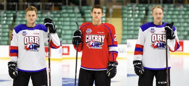 Kelowna Rockets defencemen Lassi Thomson and Kaedan Korczak and forward Nolan Foote