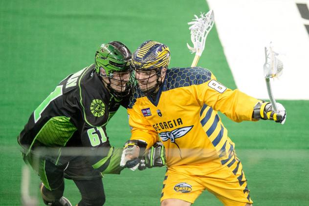 Randy Staats of the Georgia Swarm pushes against the Saskatchewan Rush