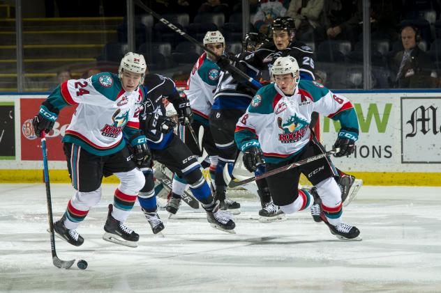 Kelowna Rockets center Kyle Topping (24) corrals the puck against the Victoria Royals