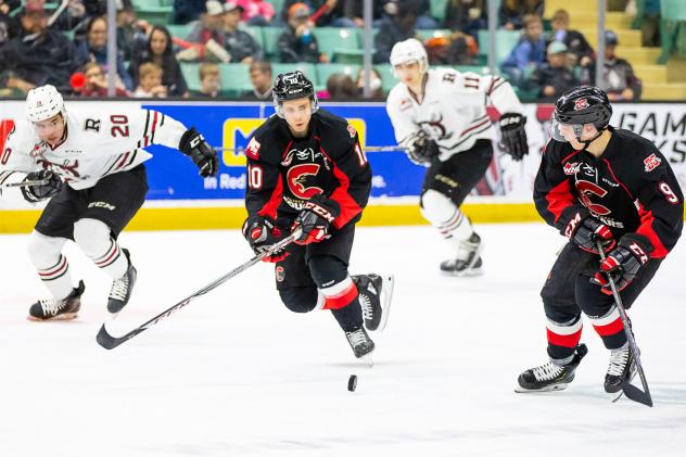 Prince George Cougars right wing Josh Curtis (10) and left wing Tyson Upper (9) against the Red Deer Rebels