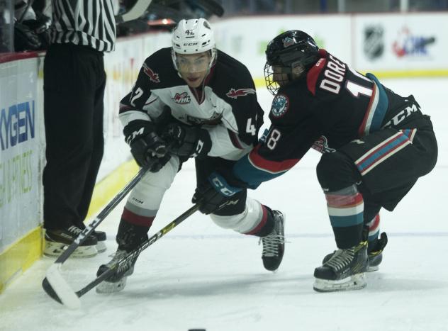 Vancouver Giants center Justin Sourdif works along the boards against the Kelowna Rockets