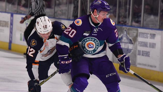 Greenville Swamp Rabbits forward Johno May (left) vs. the Orlando Solar Bears