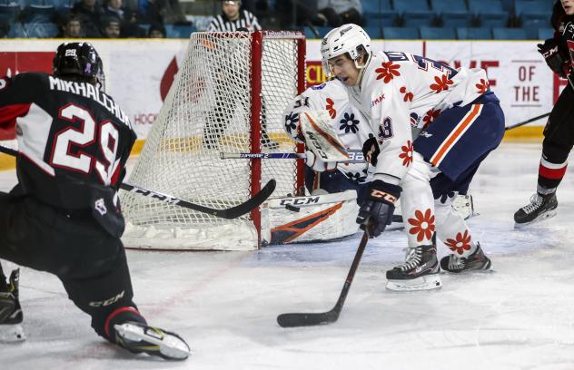 Vladislav Mikhalchuk of the Prince George Cougarsscores against the Kamloops Blazers