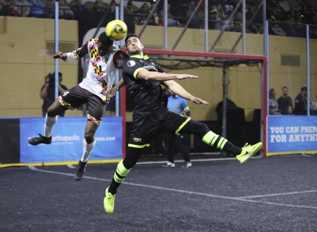 Ibrahima Keita of the Baltimore Blast (left) and a Milwaukee Wave opponent battle for the ball
