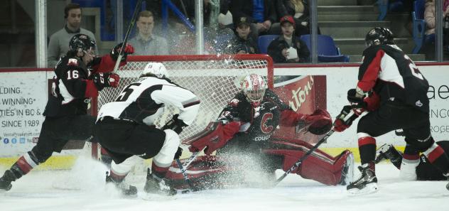 Prince George Cougars goaltender Isaiah DiLaura tries to stop the Vancouver Giants