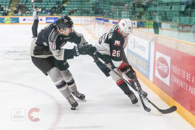 Vancouver Giants defenseman Nicholas Draffin (left) vs. Prince George Cougars right wing Reid Perepeluk