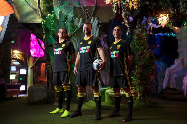 New Mexico United model the Meow Wolf jerseys
