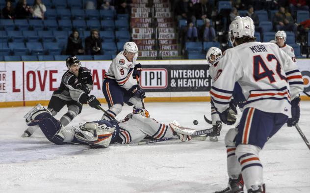 Vancouver Giants fight for the puck in front of the Kamloops Blazers' net