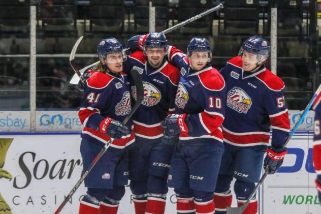 Saginaw Spirit gather after a goal