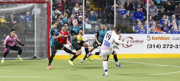 St. Louis Ambush defend against a hard Kansas City Comets' shot