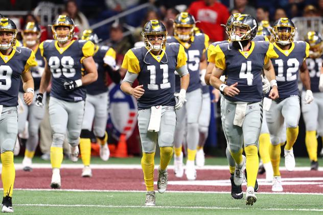 QB Mike Bercovici (11) leads the San Diego Fleet onto the field for its first game