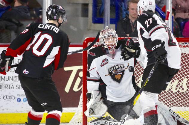 Vancouver Giants goaltender David Tendeck stops a Prince George Cougars' shot