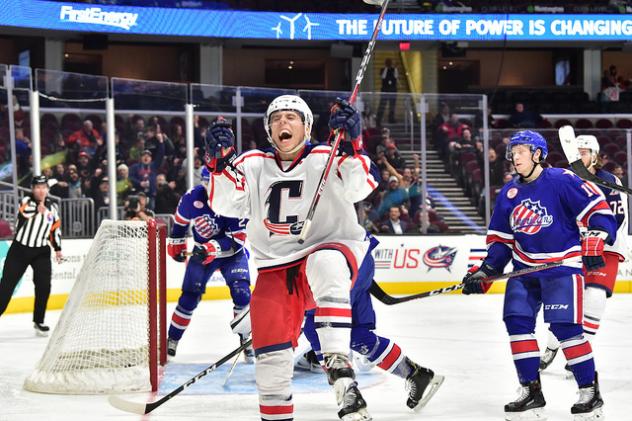 Cleveland Monsters react after a goal against the Rochester Americans