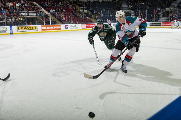 Kelowna Rockets defenceman Kaedan Korczak races to the puck against the Everett Silvertips