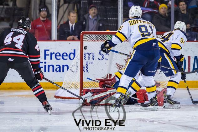Akil Thomas of the Niagara IceDogs scores against the Erie Otters