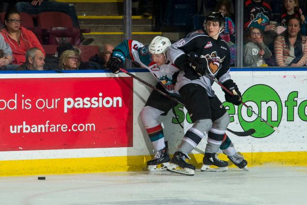 Vancouver Giants right wing Davis Koch pins a Kelowna Rocket against the boards