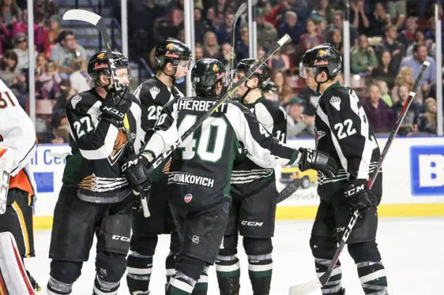 Utah Grizzlies celebrate a goal against the Kansas City Mavericks