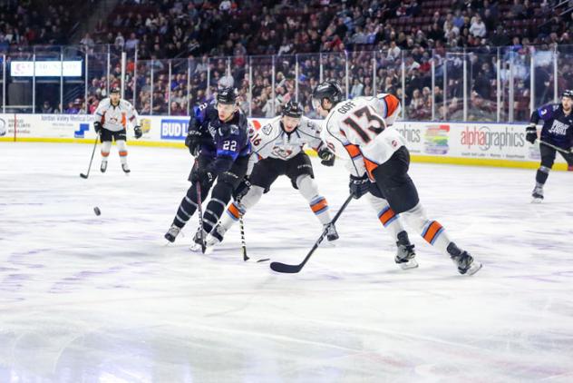 Utah Grizzlies center Josh Dickinson races for the puck against the Kansas City Mavericks