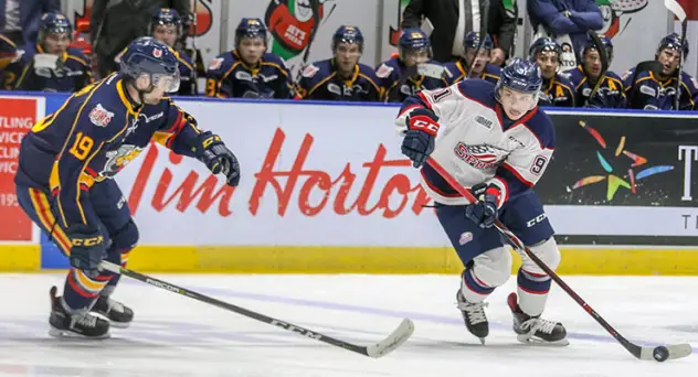 Saginaw Spirit left wing Cole Perfetti (right) against the Barrie Colts