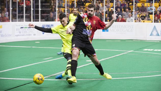 Andrew Hoxie of the Baltimore Blast (right) screens a member of the Milwaukee Wave