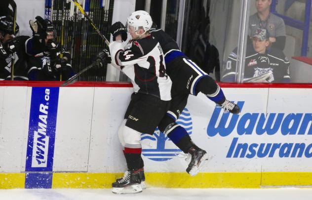 Vancouver Giants defenceman Bowen Byram checks a member of the Victoria Royals