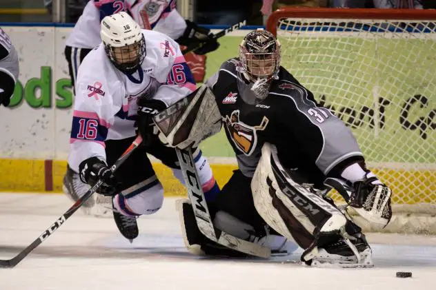 Vancouver Giants goaltender Trent Miner reaches for a puck against the Victoria Royals