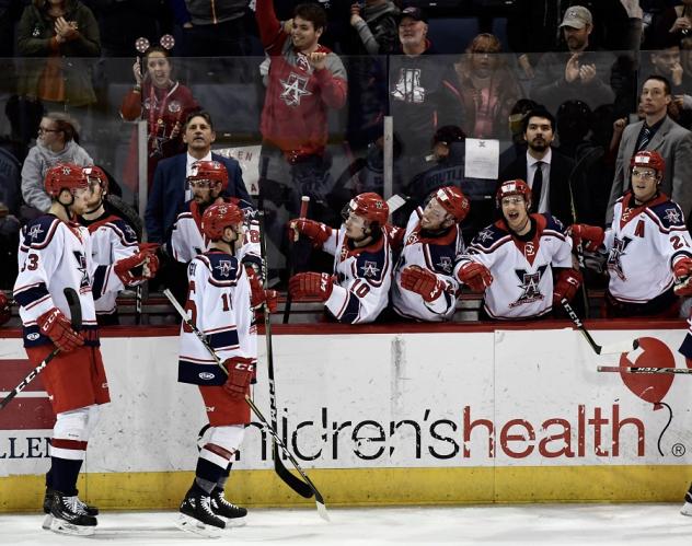 Allen Americans exchange congratulations after a Spencer Asuchak goal