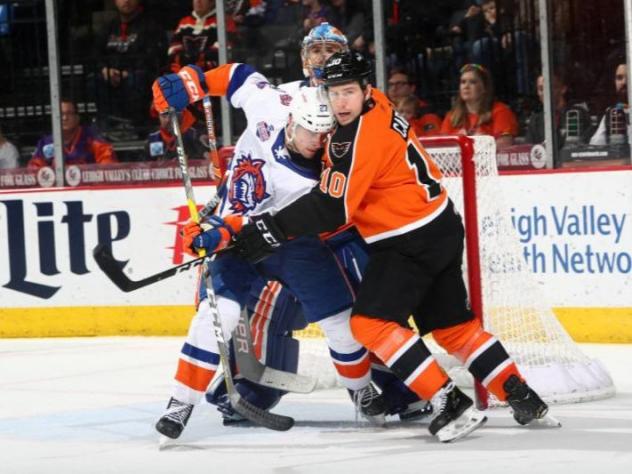 Lehigh Valley Phantoms left wing Greg Carey muscles in against the Bridgeport Sound Tigers